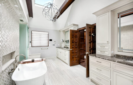 Columbus, Ohio bathroom remodel featuring a freestanding tub, two custom vanities and French doors.
